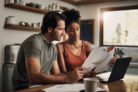 young couple looking over documents